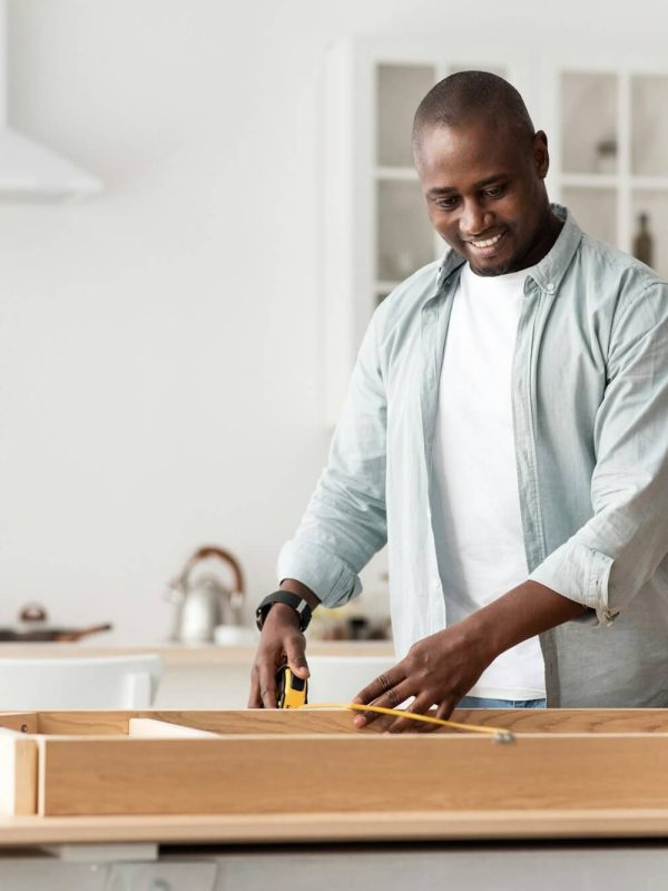 handyman-working-at-home-repairing-assembling-and-renovation-or-new-hobby-man-measuring-new-table.jpg